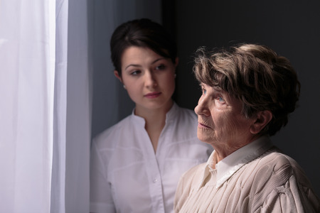 55290731 Sad Older Woman In Nursing Home Waiting For Relatives